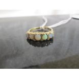 An opal & diamond 5 stone ring