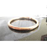 A 9ct gold bangle