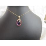 A 9ct gold amethyst pendant & chain with pink stones