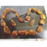 A Cobra & Bellamy style Amber necklace and earrings