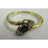 An 18ct Edwardian diamond and sapphire trilogy ring