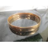 A 9ct gold bangle