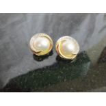 A pair of gold and pearl earrings