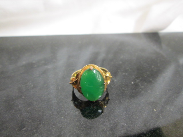 A 14k Chinese cabochon Jadeite ring,