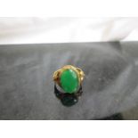 A 14k Chinese cabochon Jadeite ring,