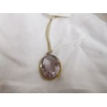 An 18ct gold amethyst pendant & chain