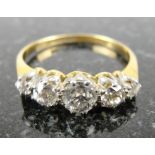 An 18ct & Platinum 5 Stone Diamond Ring:
Set with graduating old cut diamonds in claw setting,