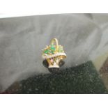 A 14k gold Emerald and Diamond basket brooch