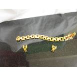 A 9ct fancy link bracelet and earrings