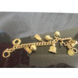 A 15ct charm bracelet & charms