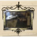 An Edwardian Adam's style brass framed mirror