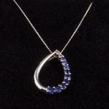 A 9ct gold tear drop pendant set with diamonds