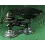 A set of Jas. Carland & Co. weigh scales and weights