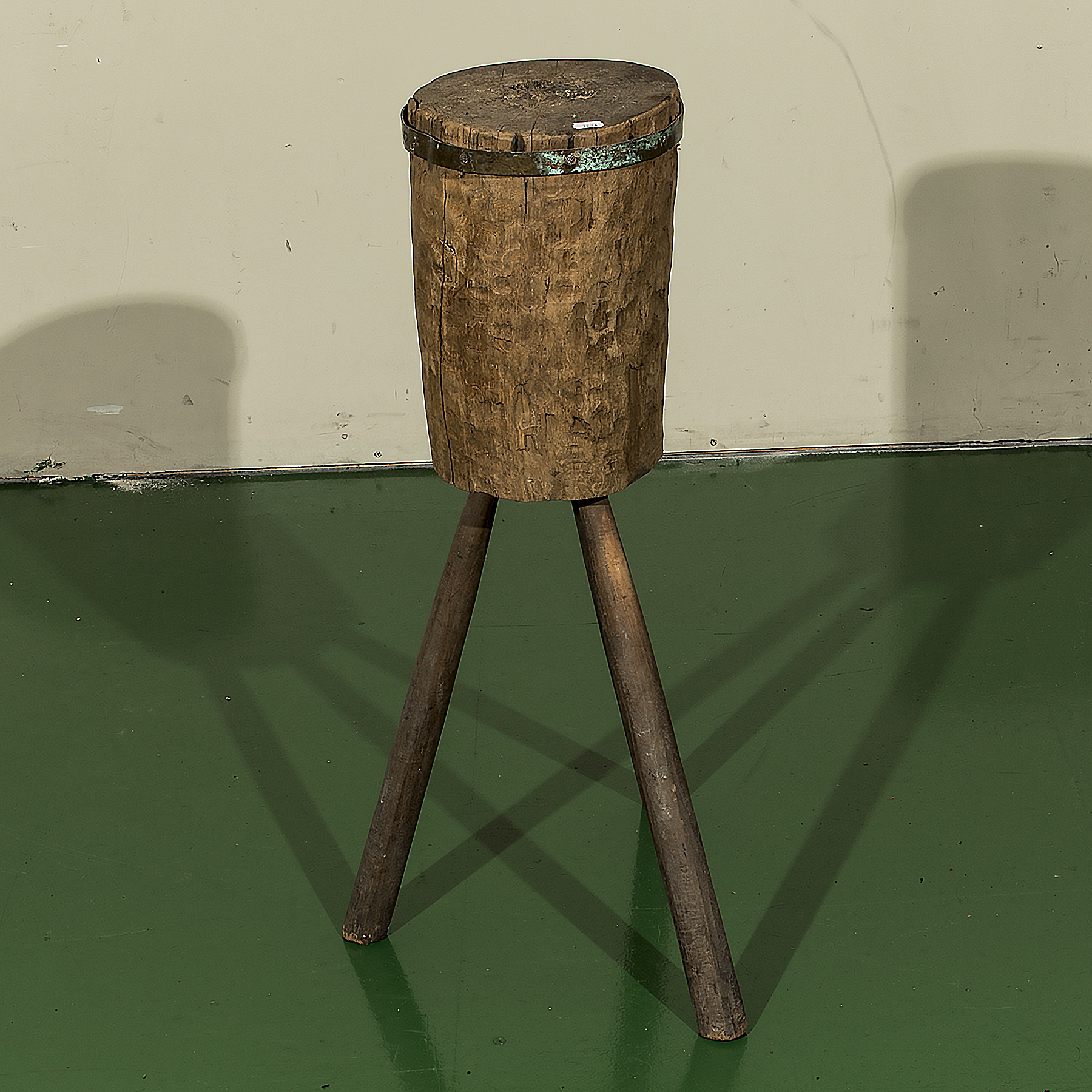 A vintage tripod chopping block