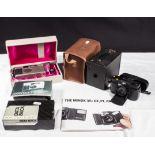A Contax T2 camera and accessories, a Kodak box Brownie together with a Minox 35 camera