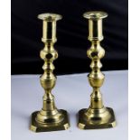 A pair of brass candlesticks