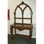 A Victorian oak hall stand with lion cabriole legs