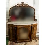 A Victorian walnut side cabinet with mirror back, two bowed panel doors and mirror centre door, with