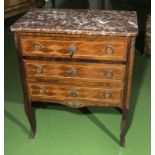 A French inlaid chest of three drawers with marble top