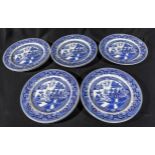 Nine 20th century blue and white willow pattern plates