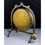 An Arts and Crafts brass table gong