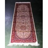 A beige ground Keshan runner, 2.1m x 0.7m