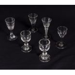 Six stemmed drinking glasses