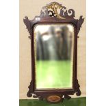 A Georgian style mahogany mirror with gilded bird and shell inlay decoration, in need or
