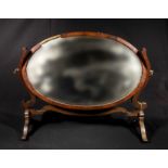 A mahogany dressing mirror in need of restoration