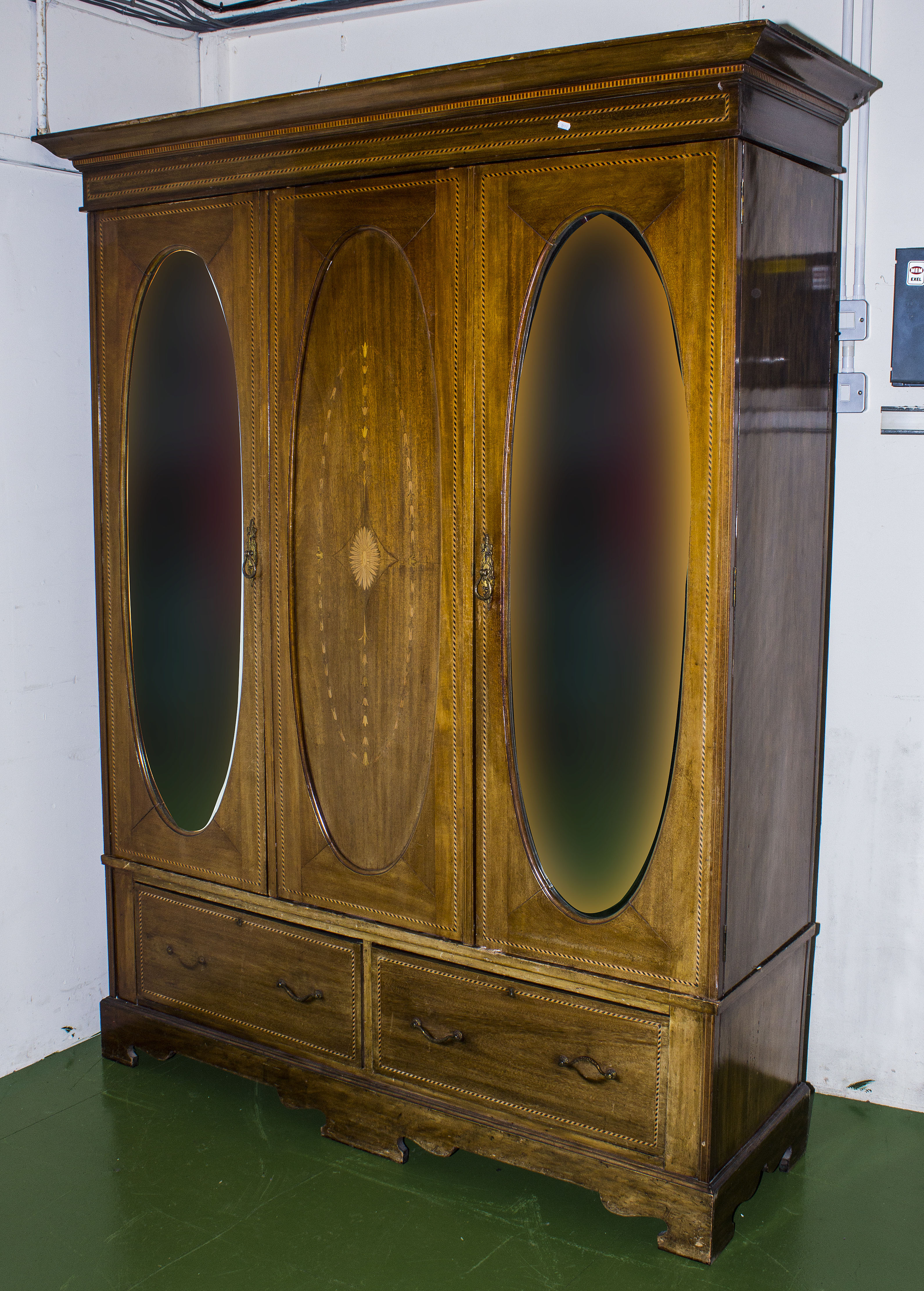 An Edwardian inlaid two door wardrobe