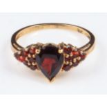 A lady's 9ct gold 2.3gm ring set with garnets