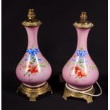 A pair of French pink porcelain table lamps with brass bases, 43cm tall