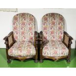 A pair of upholstered armchairs with bergere sides