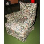 An armchair with loose covers