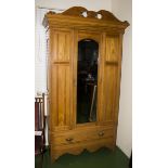 A late Victorian Arts and Crafts style ash single door wardrobe