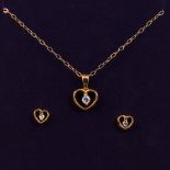 A 9ct gold cubic zirconia 2.2gm earring and pendant set