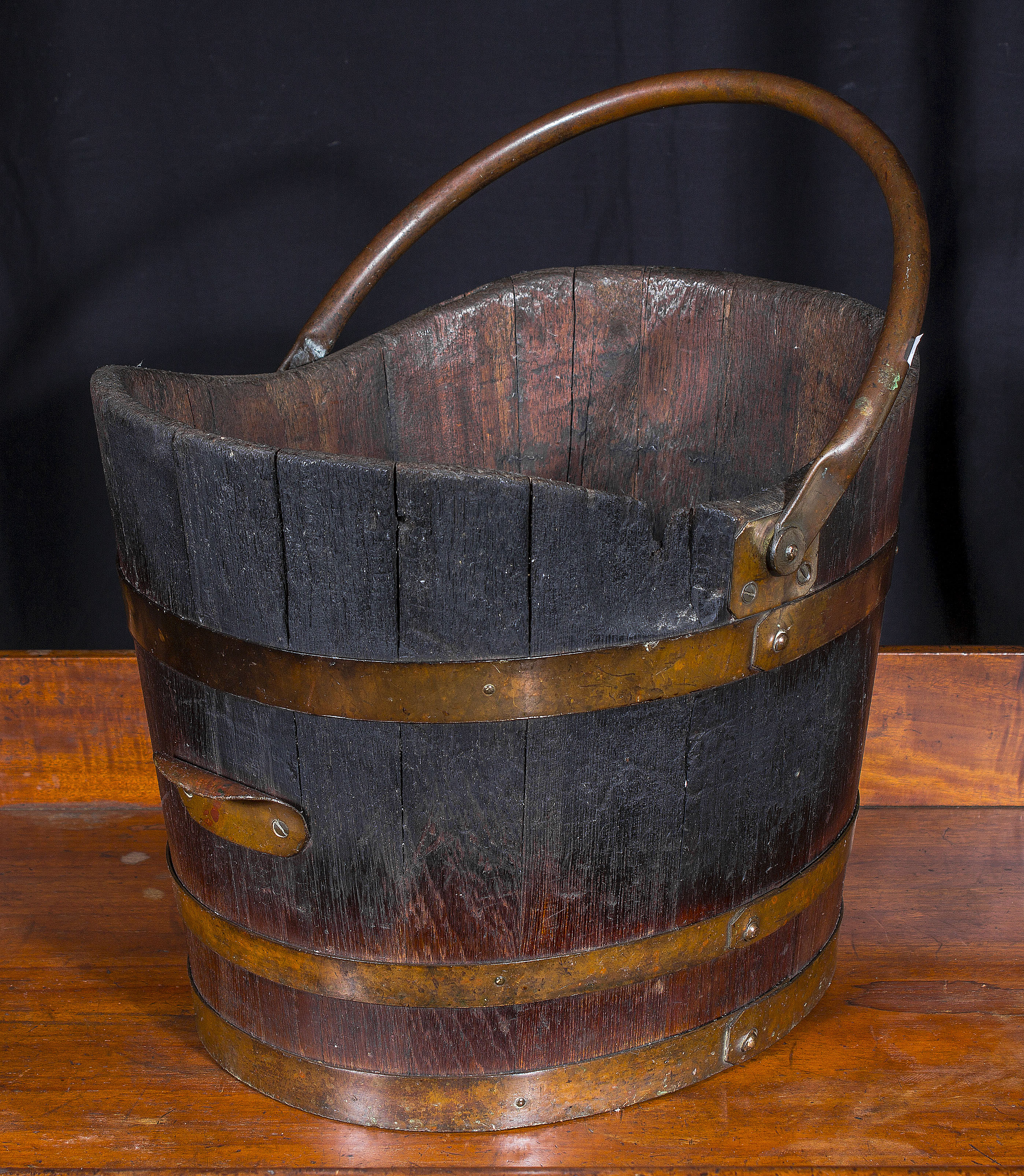 A brass bound log bucket