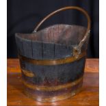 A brass bound log bucket