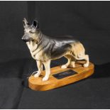 A Beswick alsatian on wooden base