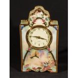 A hand painted porcelain mantle clock