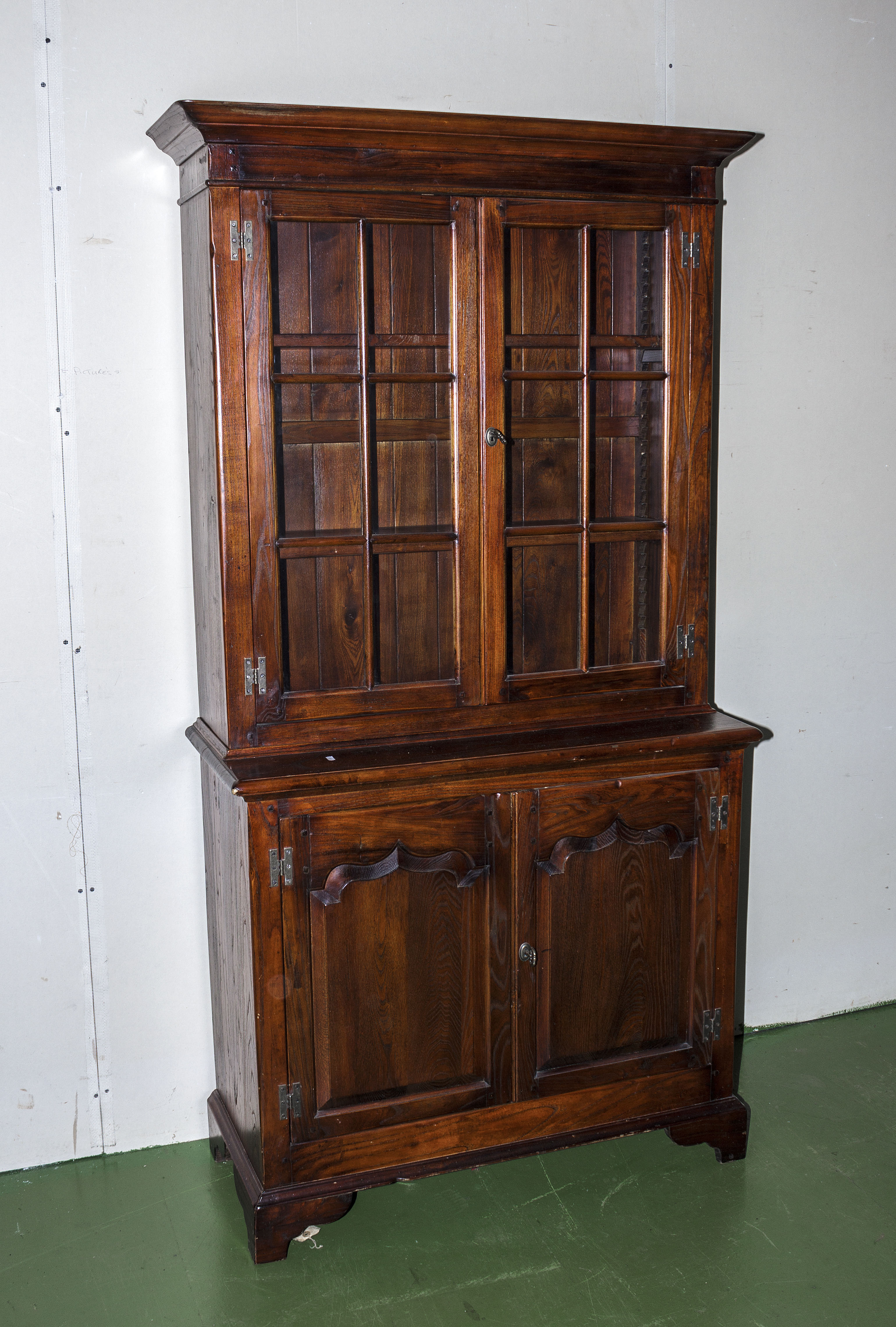 An oak reproduction bookcase on cupboard