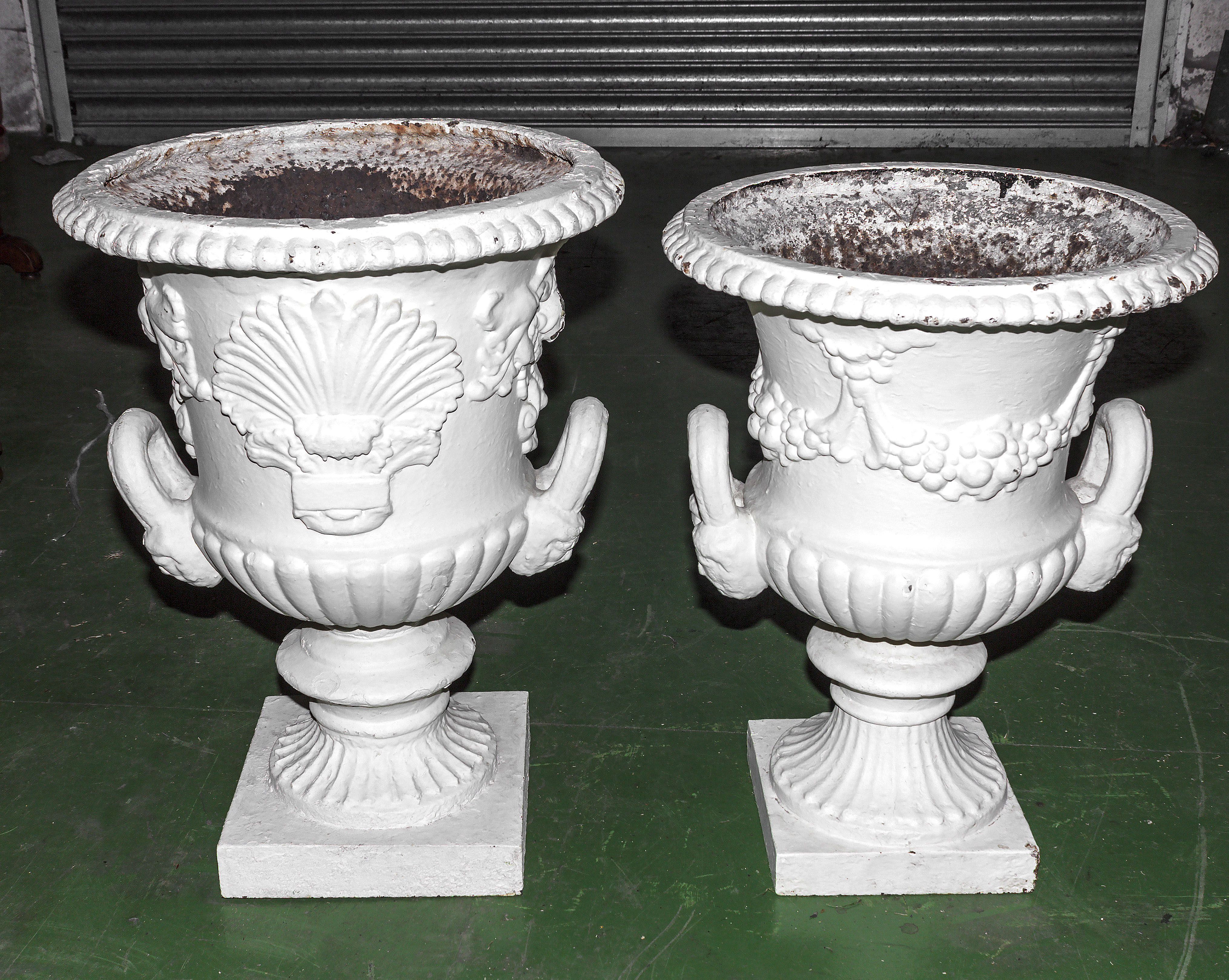 Two Victorian cast iron urns