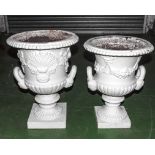 Two Victorian cast iron urns
