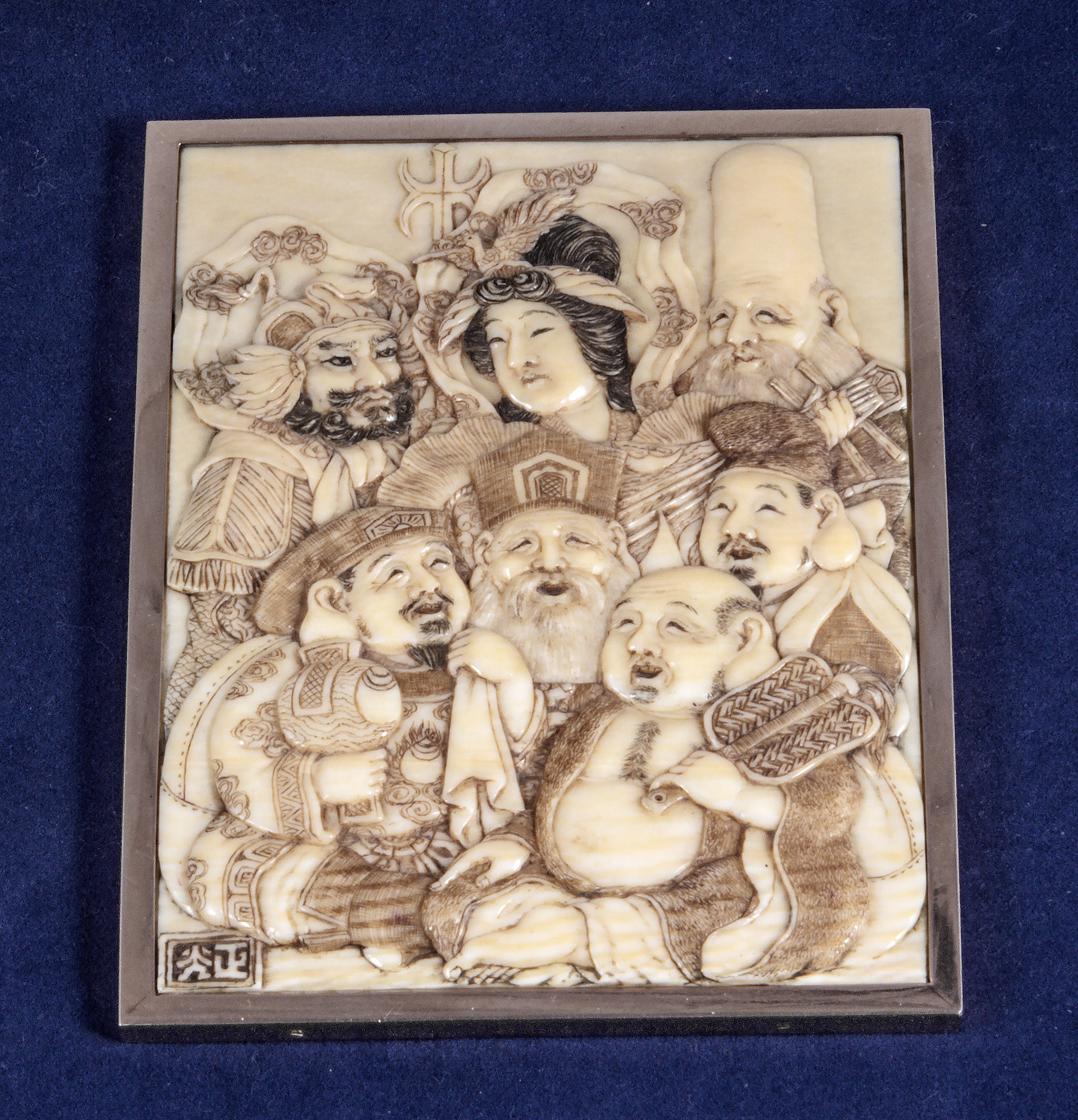 A Japanese gold mounted carved ivory panel with mirror to reverse