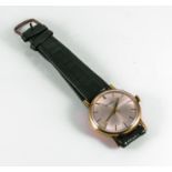 A gent's 9ct gold Garrard wristwatch with leather strap