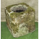 A square antique stone trough.