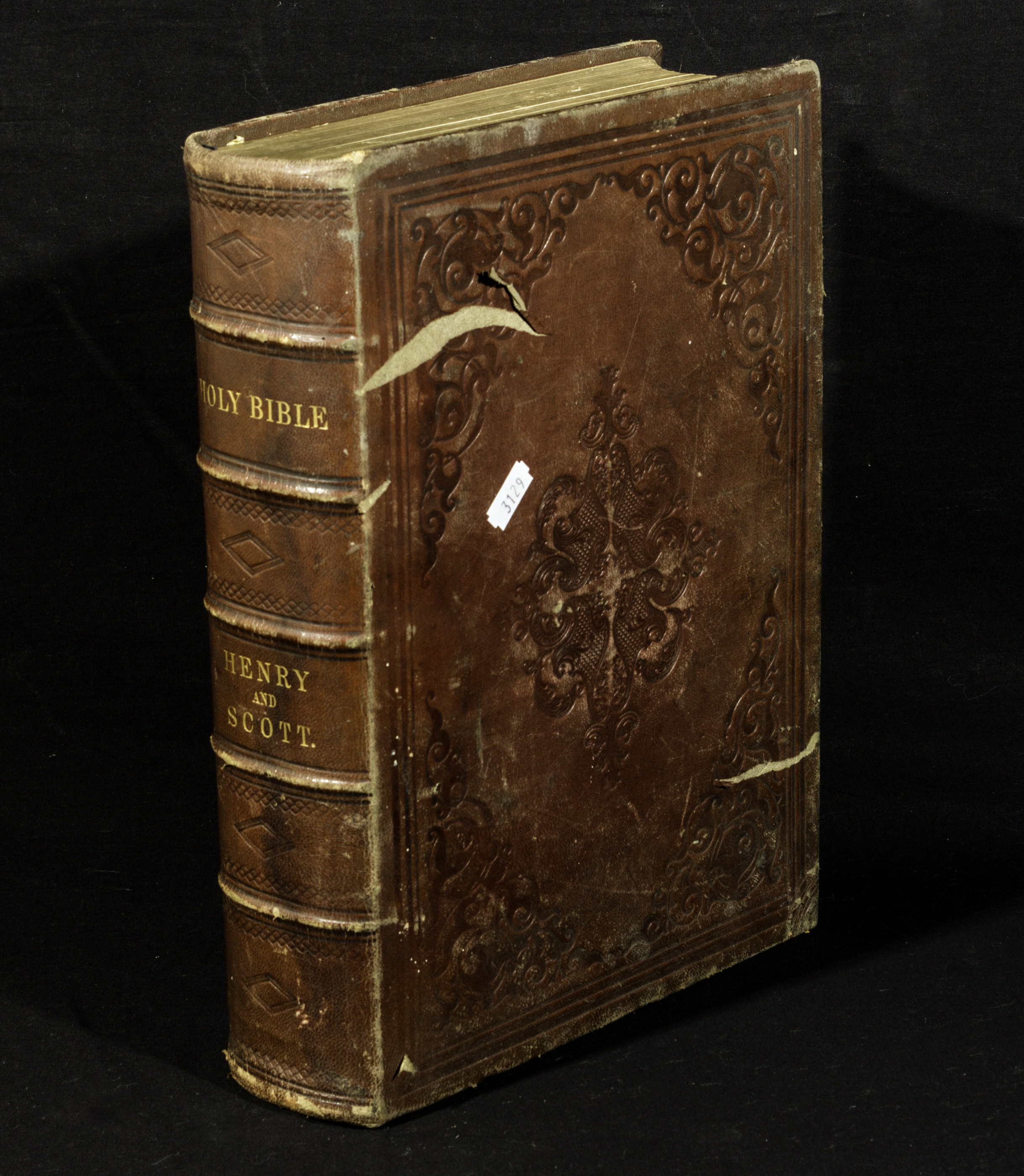 A leather bound family Bible, commentaries of Henry and Scott