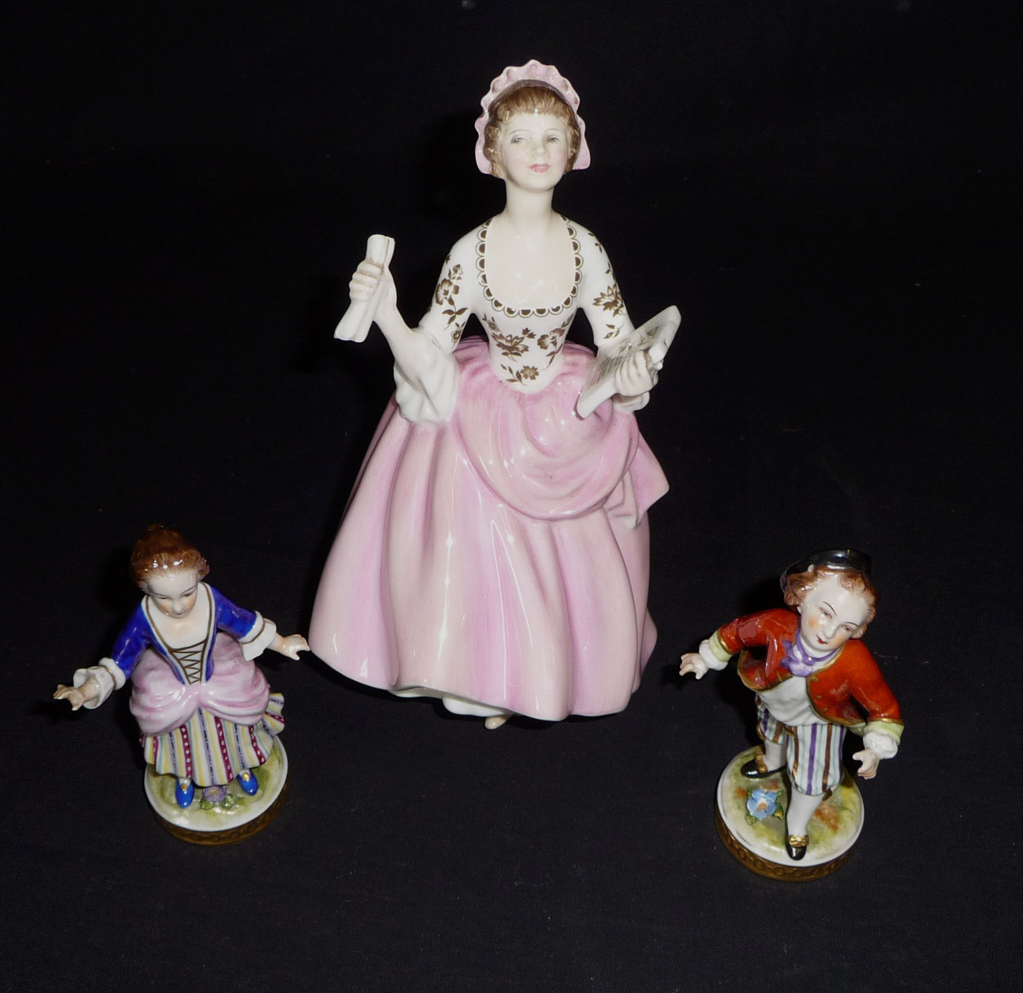 A Doulton figure and two others