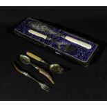 A silver plated carving set and other related cutlery