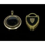 A gold locket and one other